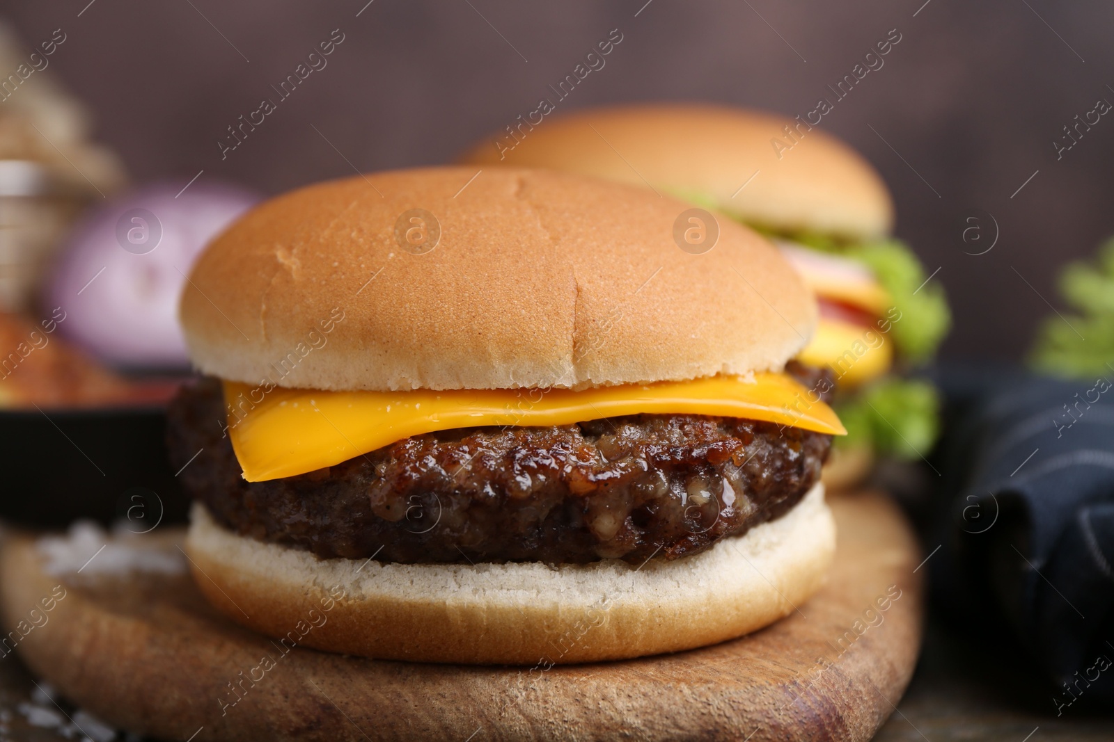 Cheeseburger with tasty patty on table, closeup Photo of Cheeseburger with tasty patty on table, closeup