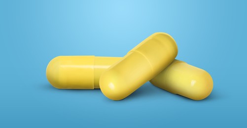 Image of Antibiotic pills. Yellow capsules on light blue background. Banner design