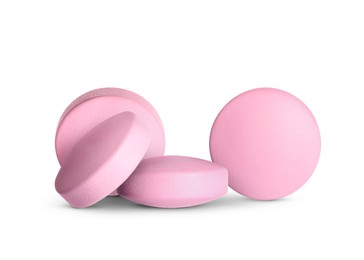 Image of Antibiotic pills. Round pink tablets on white background