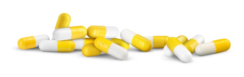 Image of Antibiotic pills. Yellow and white capsules on white background