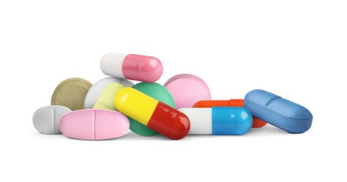 Image of Many different antibiotic pills on white background