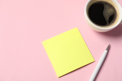 Photo of Sticky note, pen and coffee on pink background, closeup. Space for text