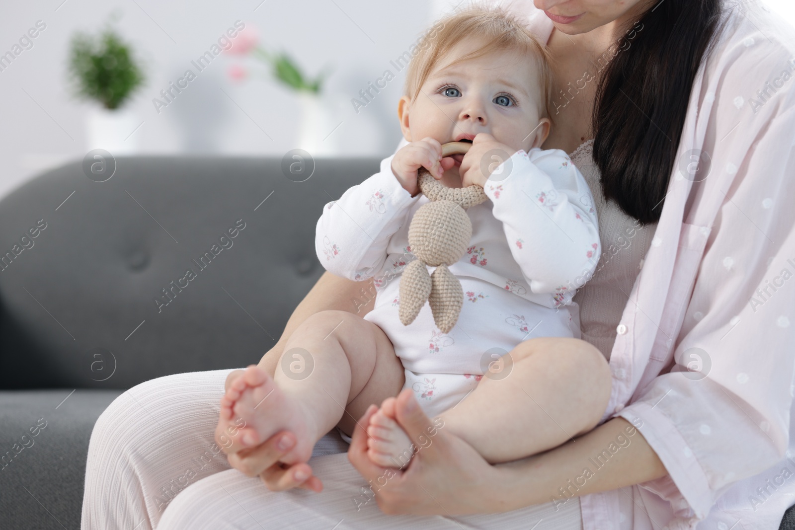 Mother with her little baby at home, closeup Photo of Mother with her little baby at home, closeup