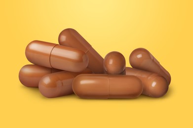 Image of Antibiotic pills. Brown capsules on orange gradient background