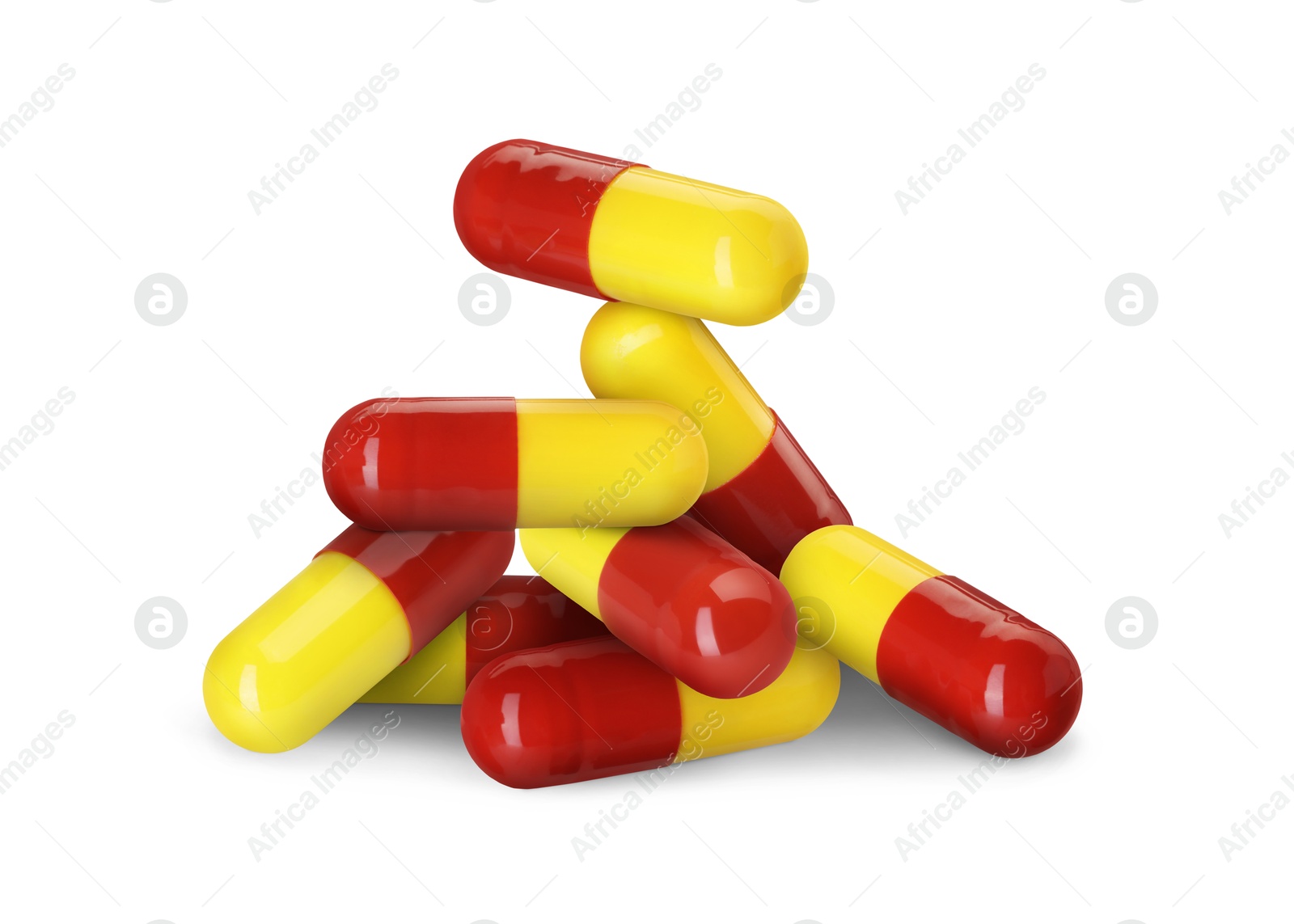 Antibiotic pills. Yellow and red capsules on white background Image of Antibiotic pills. Yellow and red capsules on white background
