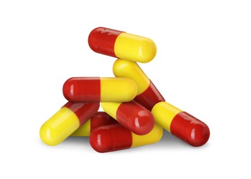 Image of Antibiotic pills. Yellow and red capsules on white background