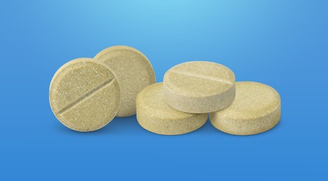 Image of Antibiotic pills. Round tablets on blue gradient background. Banner design