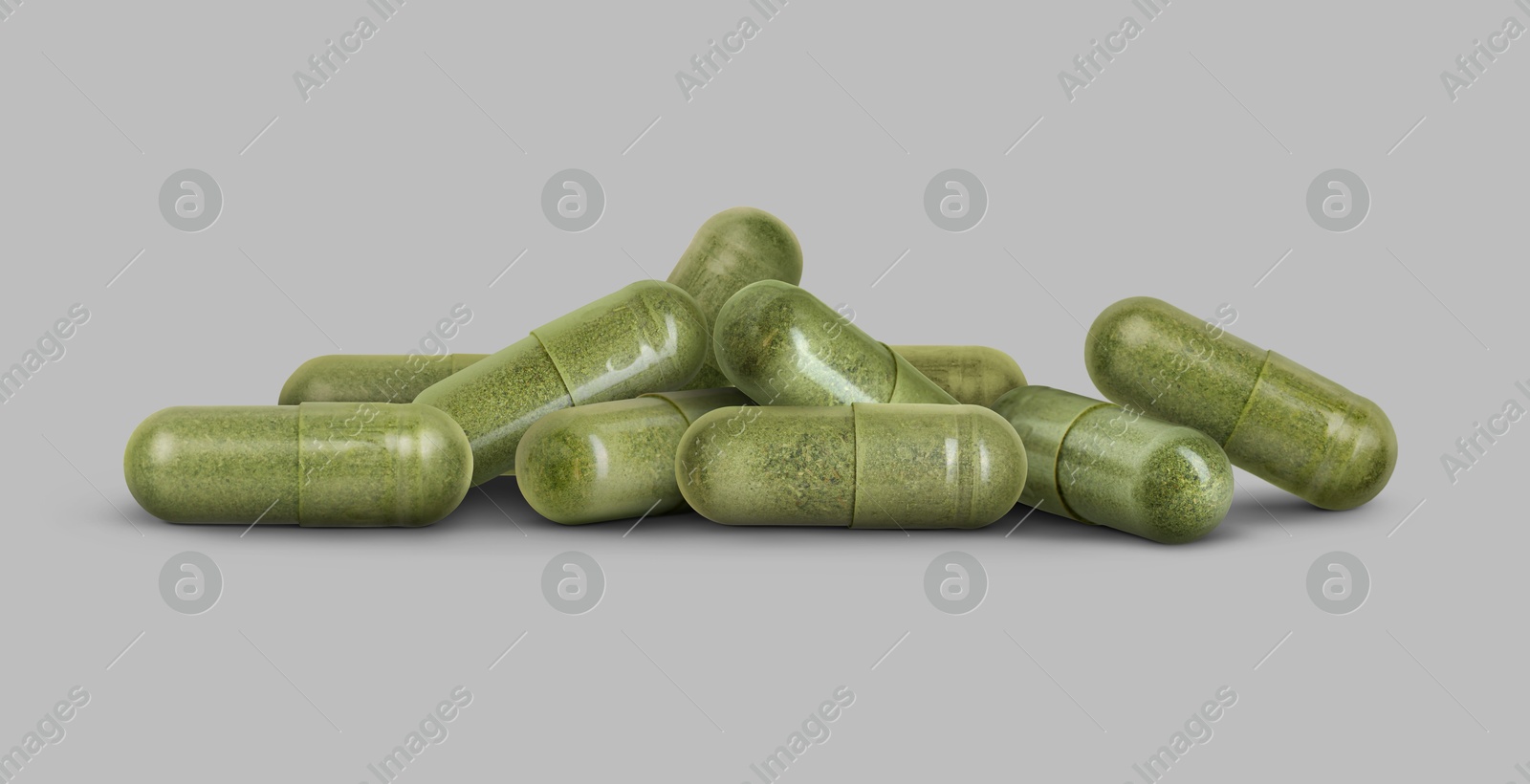 Antibiotic pills. Green capsules on grey background. Banner design Image of Antibiotic pills. Green capsules on grey background. Banner design