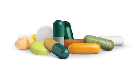 Image of Many different antibiotic pills on white background