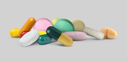 Image of Different antibiotic pills on grey background. Banner design