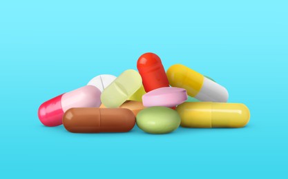 Image of Different antibiotic pills on light blue background. Banner design