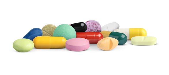 Image of Many different antibiotic pills on white background