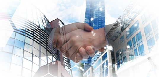 Image of Deal or partnership concept. Double exposure with cityscape and photo of businesspeople shaking hands. Banner design