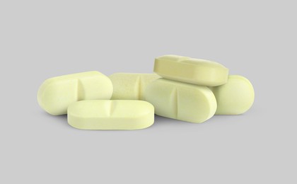 Image of Antibiotic pills. Oval tablets on light grey background. Banner design