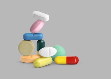 Image of Many different antibiotic pills on grey background