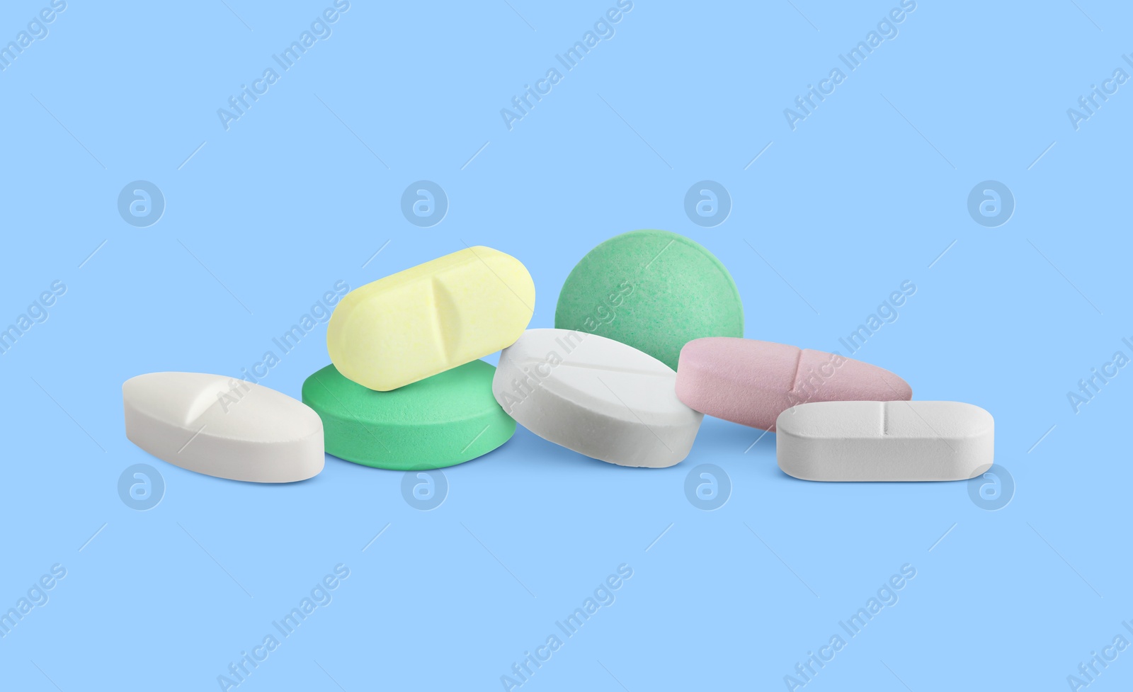 Different antibiotic pills on light blue background. Banner design Image of Different antibiotic pills on light blue background. Banner design