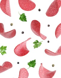Image of Salami sausage slices, peppercorns and parsley flying on white background
