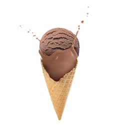 Image of Chocolate ice cream in waffle cone and splash of milk on white background