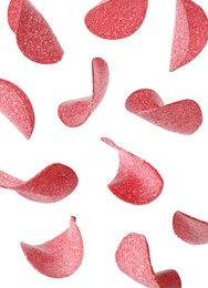 Image of Salami sausage slices flying on white background