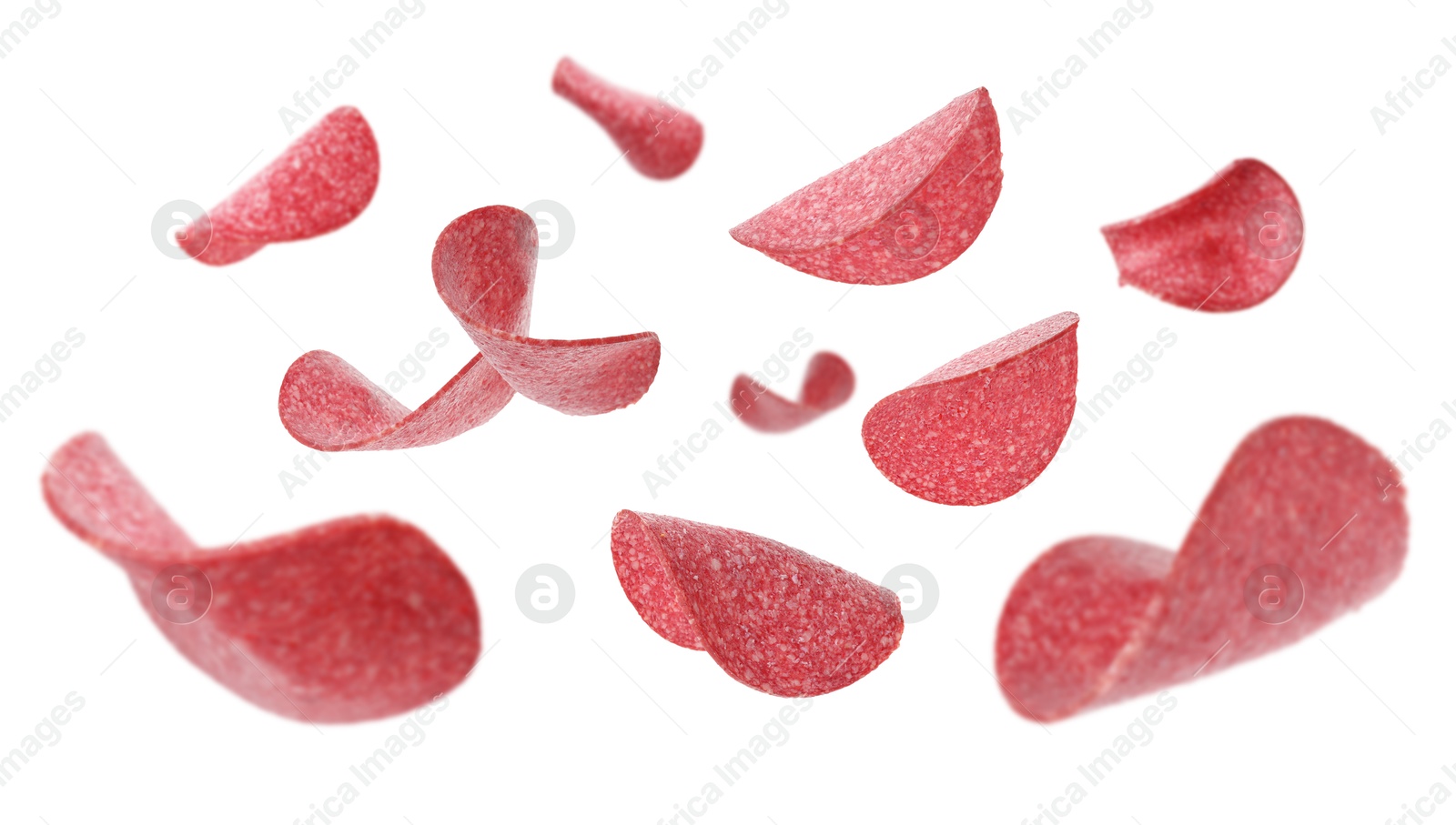 Salami sausage slices flying on white background Image of Salami sausage slices flying on white background