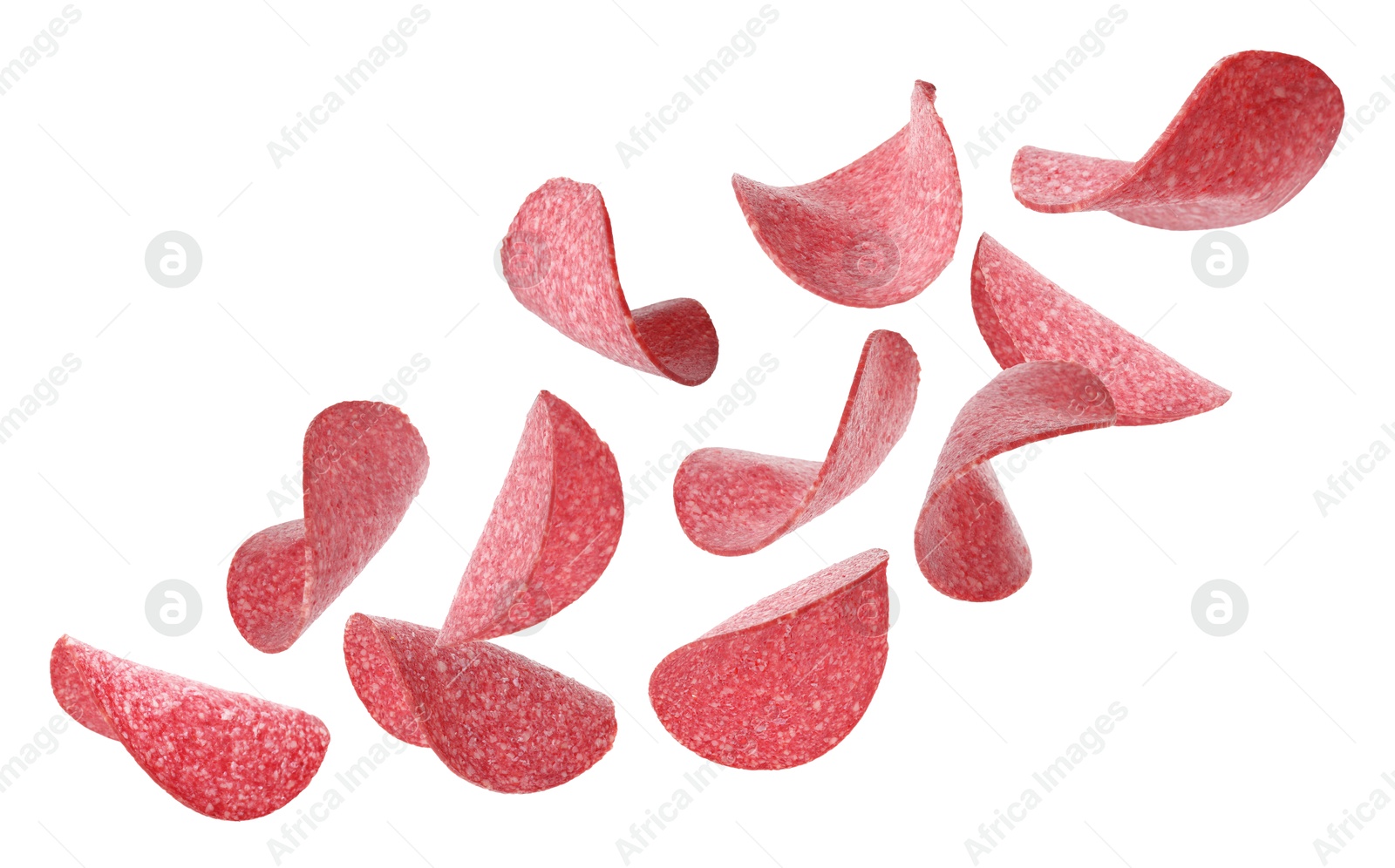 Salami sausage slices flying on white background Image of Salami sausage slices flying on white background