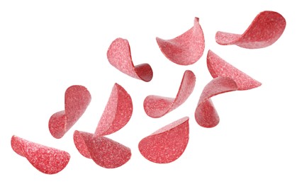 Image of Salami sausage slices flying on white background