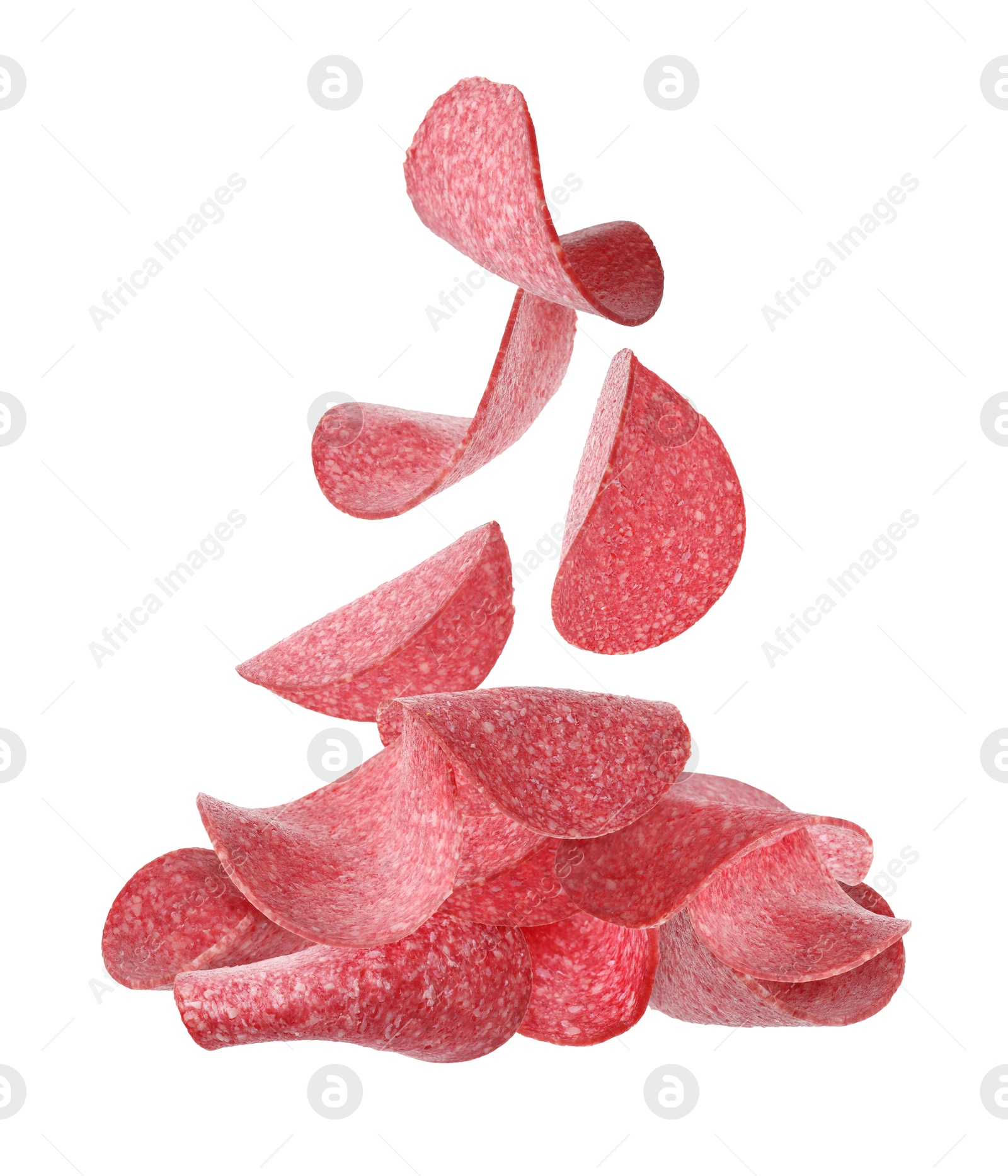 Salami sausage slices falling on white background Image of Salami sausage slices falling on white background