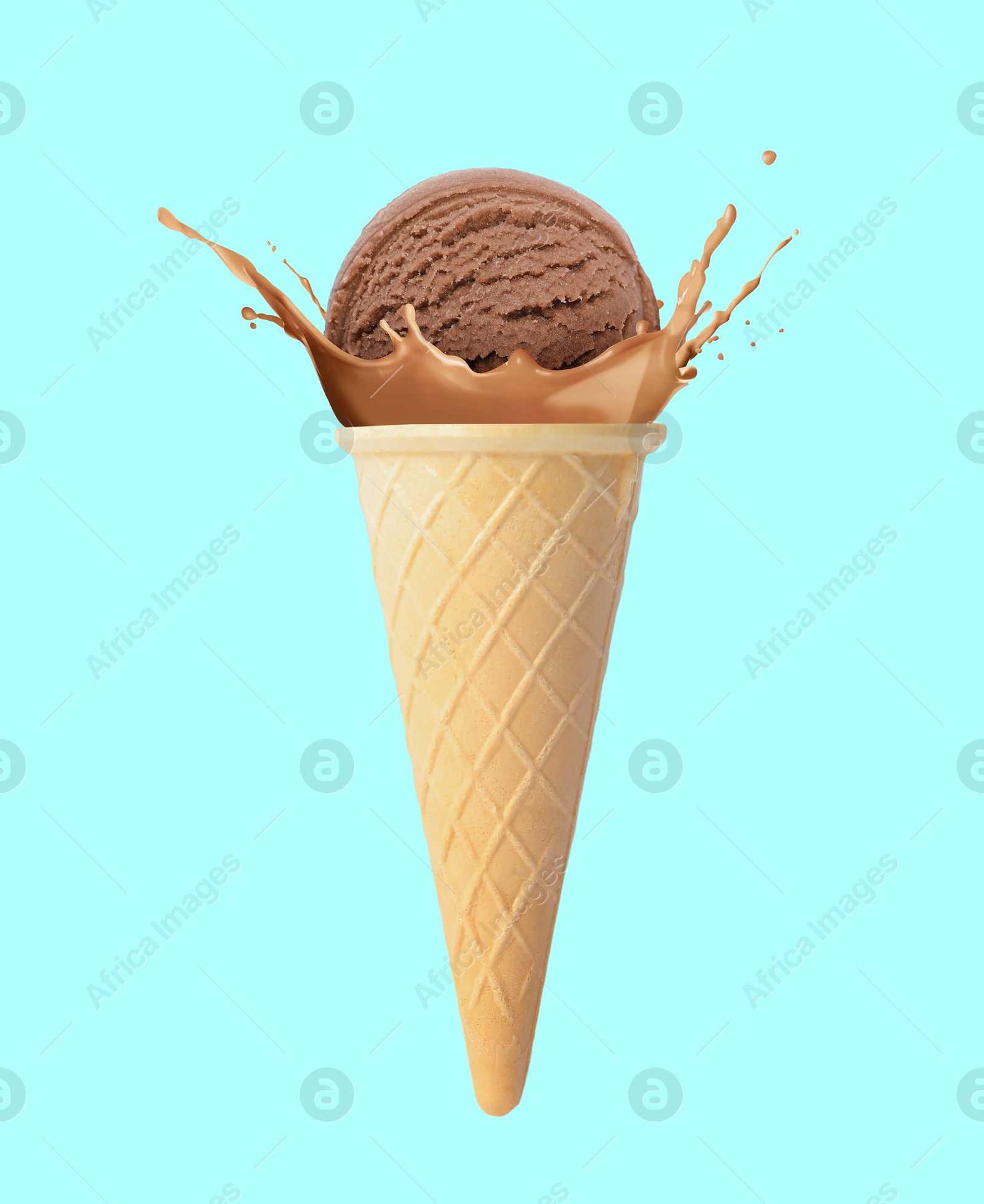Chocolate ice cream in waffle cone and splash of milk on light blue background Image of Chocolate ice cream in waffle cone and splash of milk on light blue background
