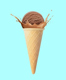 Image of Chocolate ice cream in waffle cone and splash of milk on light blue background