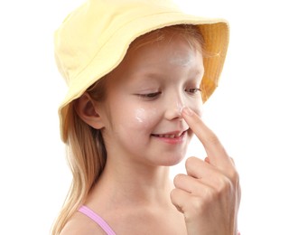 Photo of Mother applying sun protection product onto her daughter's nose on white background, closeup