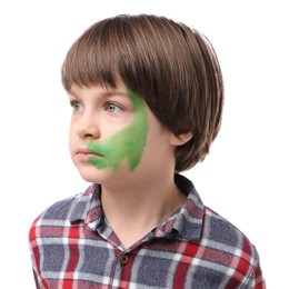Photo of Cute boy with green face painting on white background