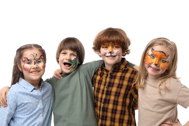Photo of Group of kids with colorful face paintings on white background