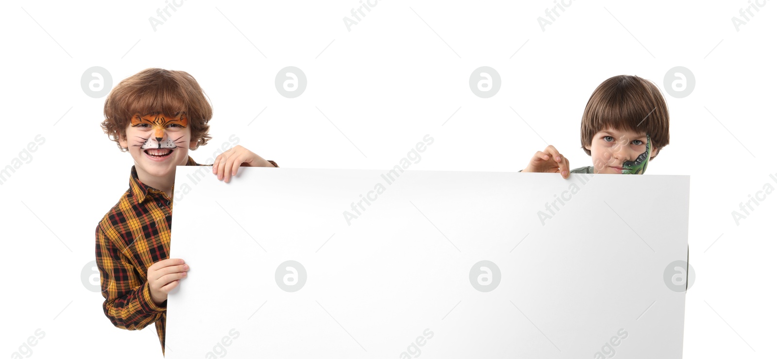 Photo of Cute boys with colorful face paintings and blank banner on white background. Space for text
