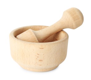 Photo of Wooden mortar with pestle isolated on white