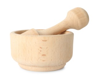 Photo of Wooden mortar with pestle isolated on white