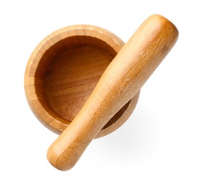 Photo of Wooden mortar with pestle isolated on white, top view