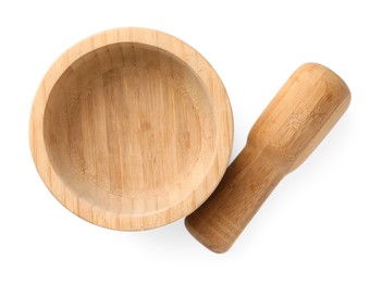 Photo of Wooden mortar with pestle isolated on white, top view