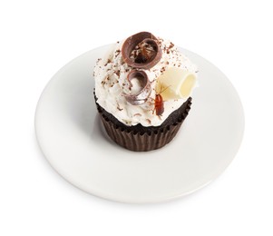 Photo of Cockroach crawling on cupcake against white background
