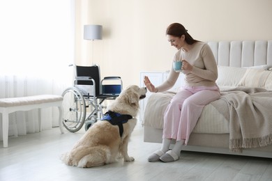 Photo of Woman with disability and her service dog at home