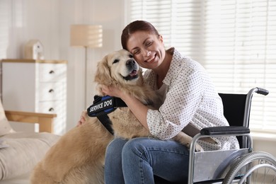 Photo of Woman in wheelchair hugging her service dog at home