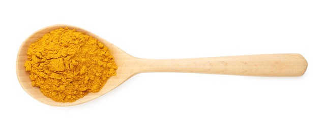 Photo of Turmeric powder in spoon isolated on white, top view. Aromatic spice