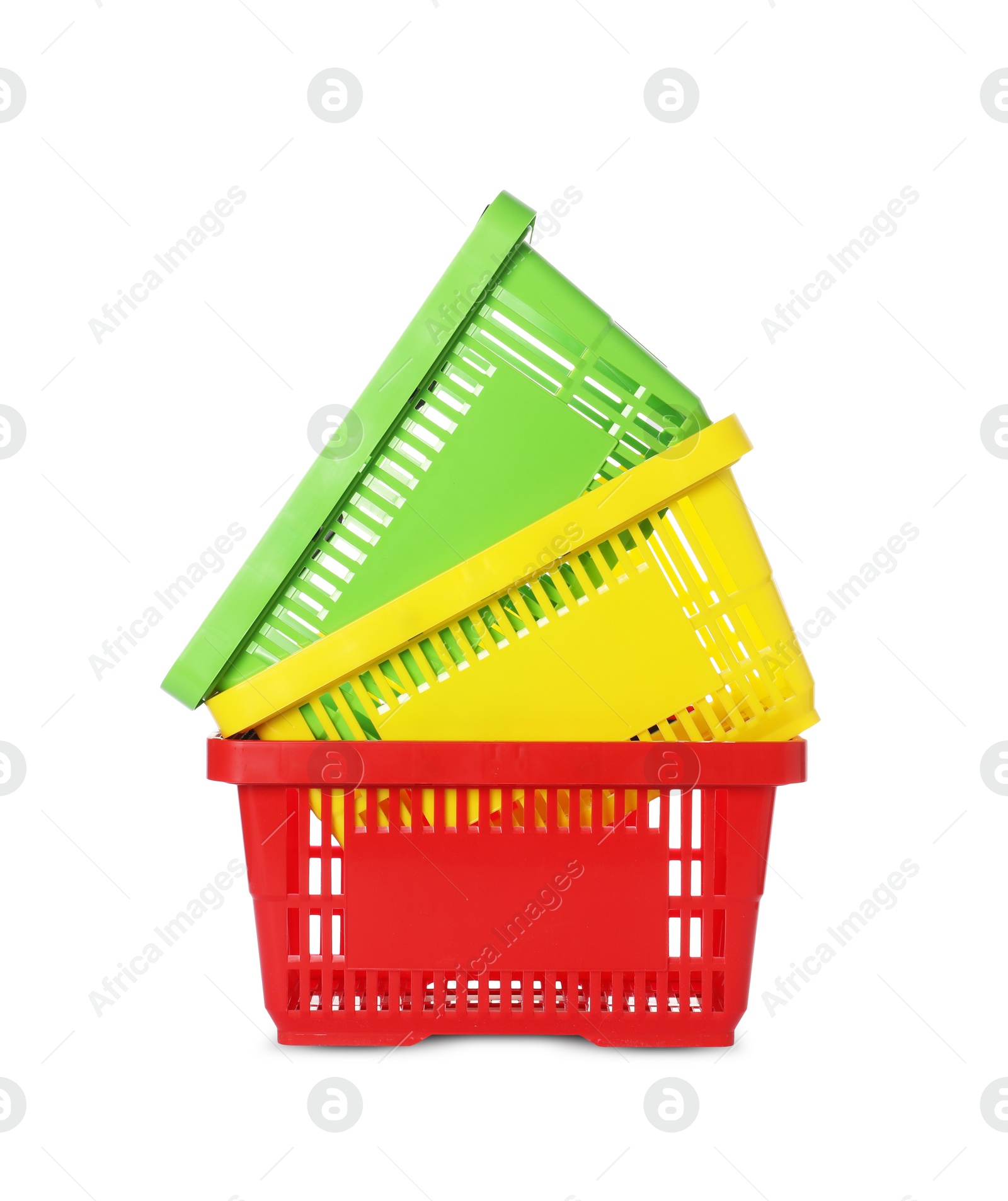 Stack of colorful shopping baskets isolated on white Photo of Stack of colorful shopping baskets isolated on white