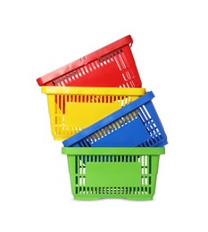 Photo of Stack of colorful shopping baskets isolated on white