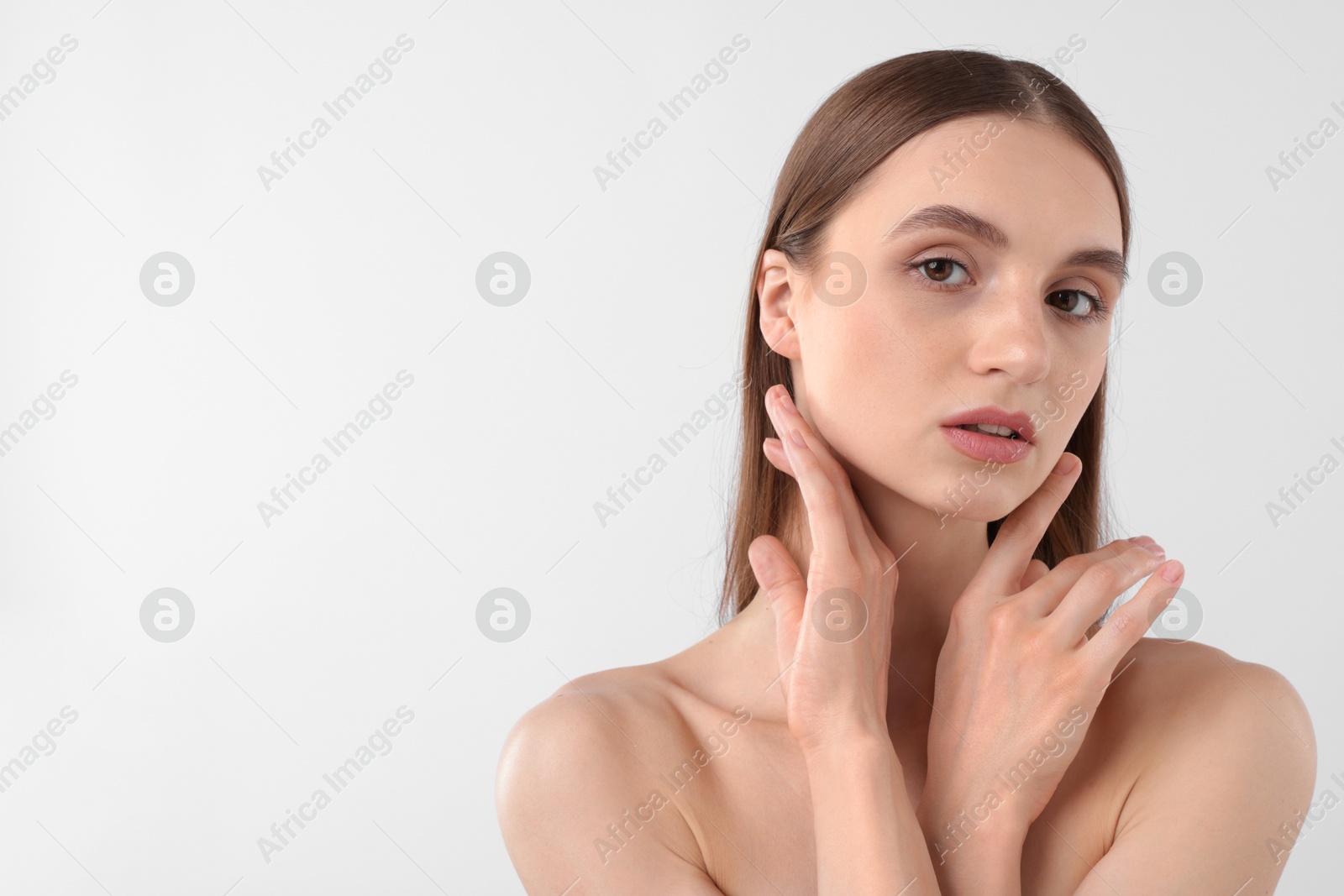 Portrait of attractive young woman on white background. Space for text Photo of Portrait of attractive young woman on white background. Space for text