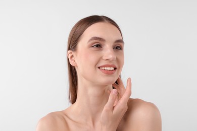 Photo of Portrait of attractive young woman on white background