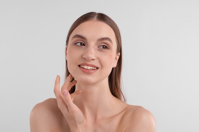 Photo of Portrait of attractive young woman on white background