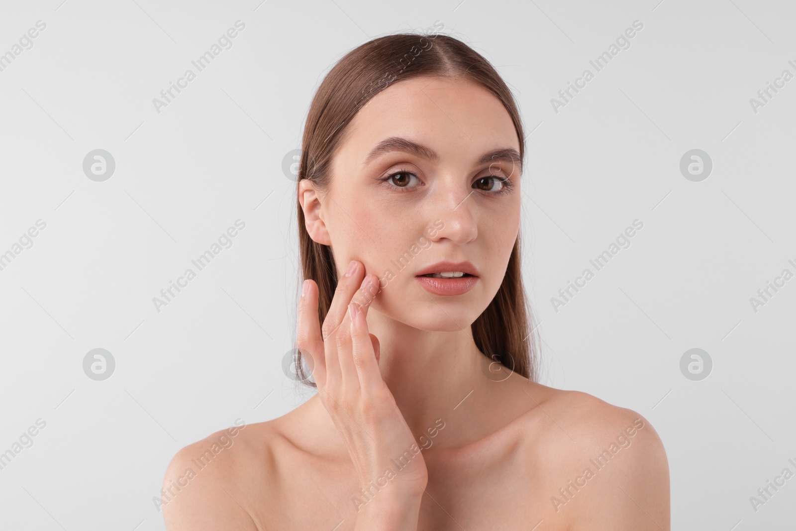 Photo of Portrait of attractive young woman on white background