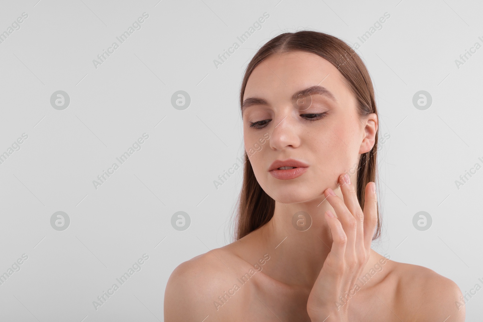 Portrait of attractive young woman on white background. Space for text Photo of Portrait of attractive young woman on white background. Space for text