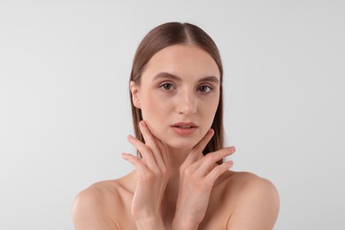 Photo of Portrait of attractive young woman on white background