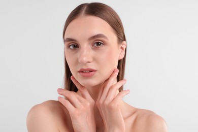 Photo of Portrait of attractive young woman on white background